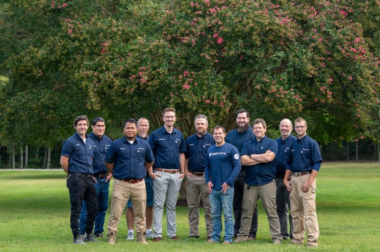 The Parahome Solutions handyman team in company uniforms standing together outdoors